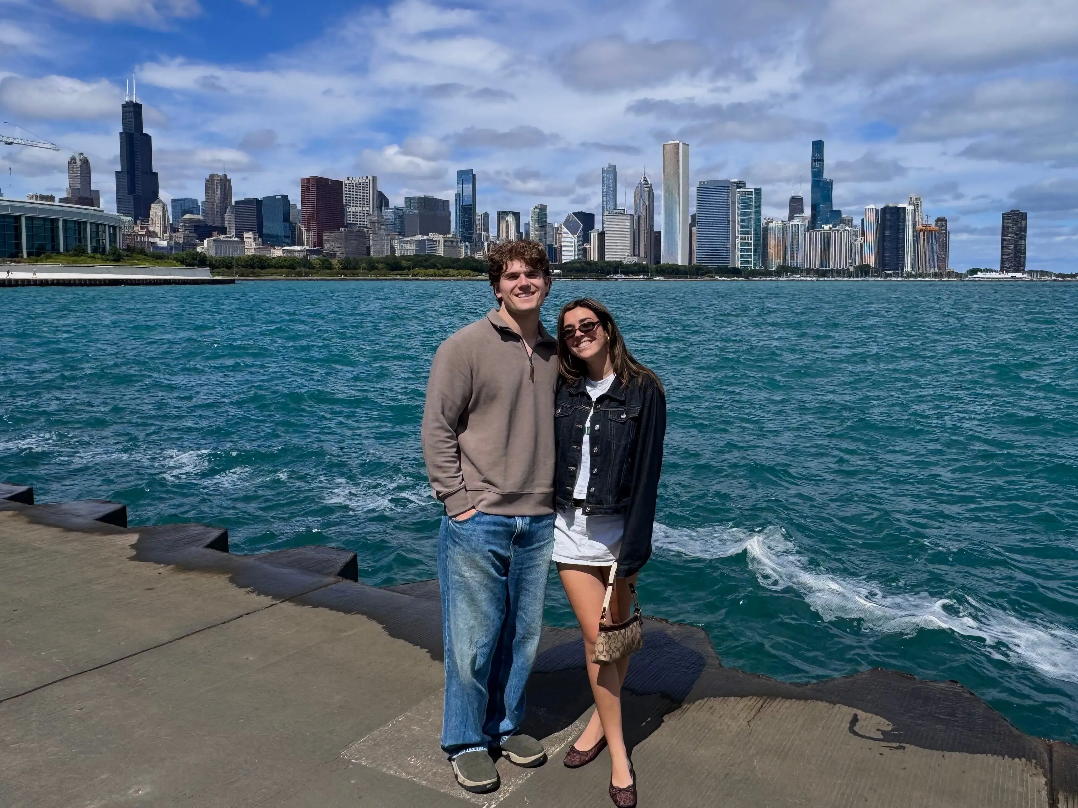 The writer and her boyfriend pose by Lake Michigan with the Chicago skyline in the background.