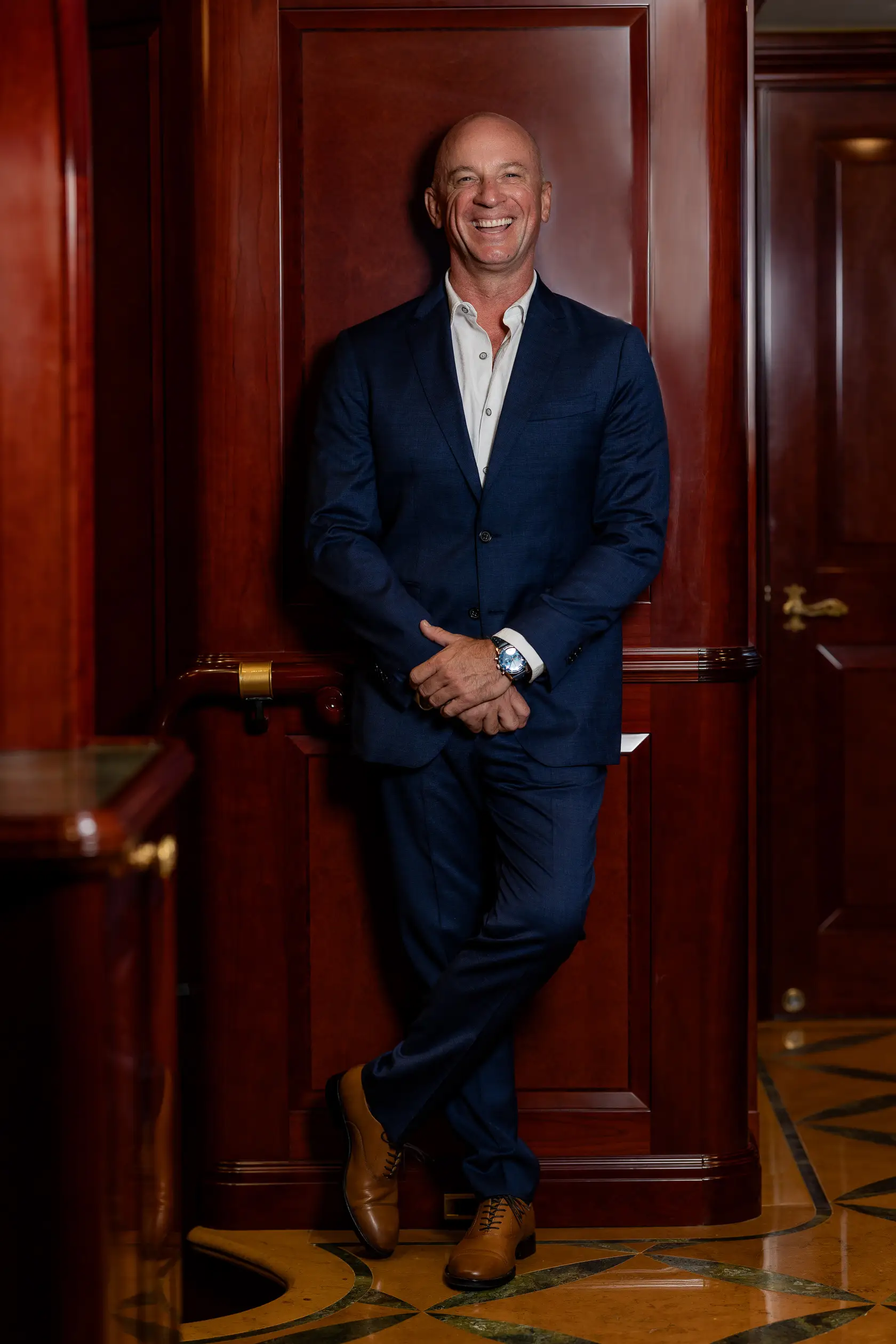 Man in a suit smiling