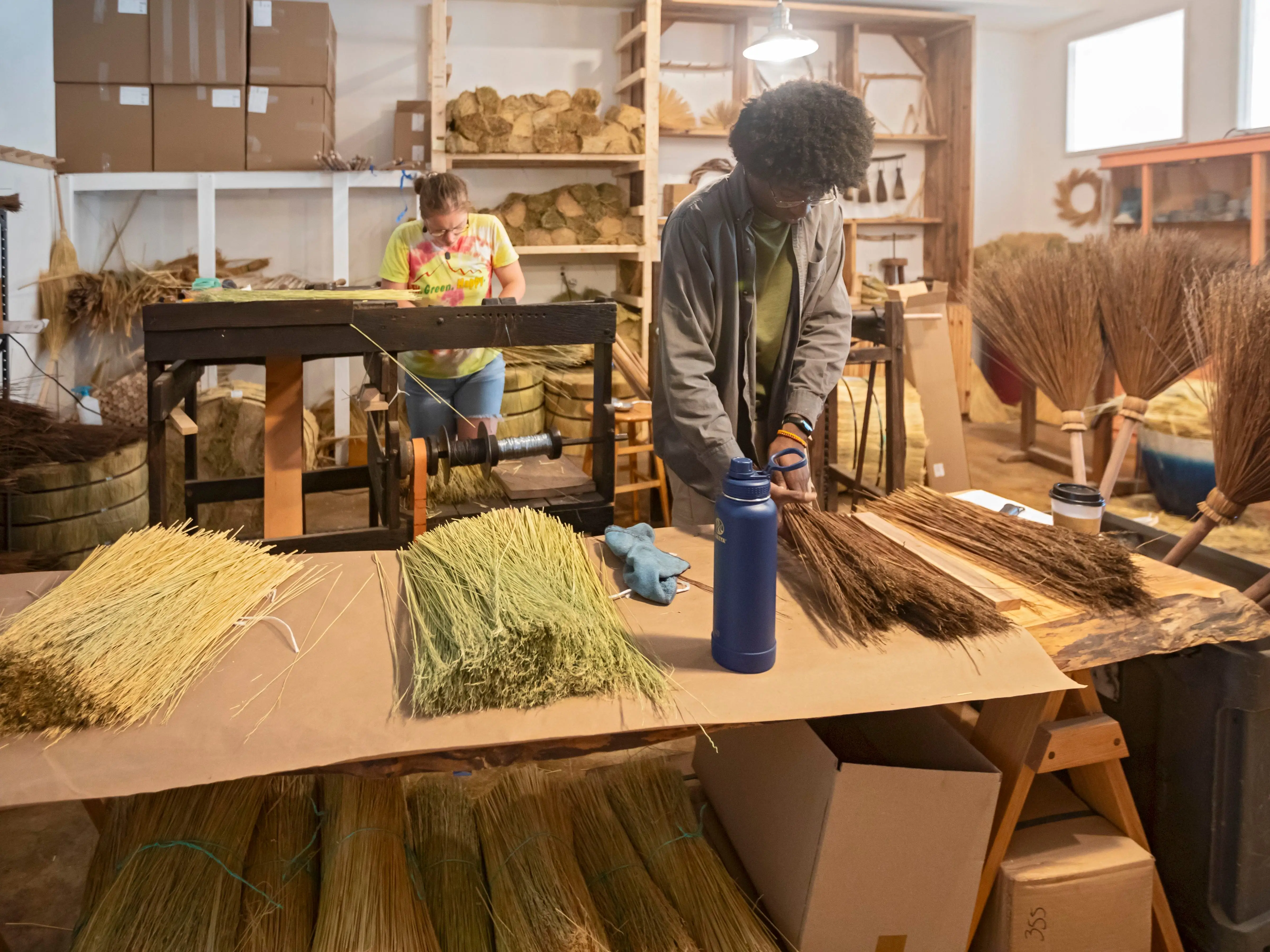Berea, Kentucky, Aja Haynes (right) and June Rosenbarker make traditional Appalachian brooms and whiskbrooms, by hand at Sunhouse Craft. They use broomcorn, a type of sorghum, and distribute their products through wholesalers and direct to consumers.