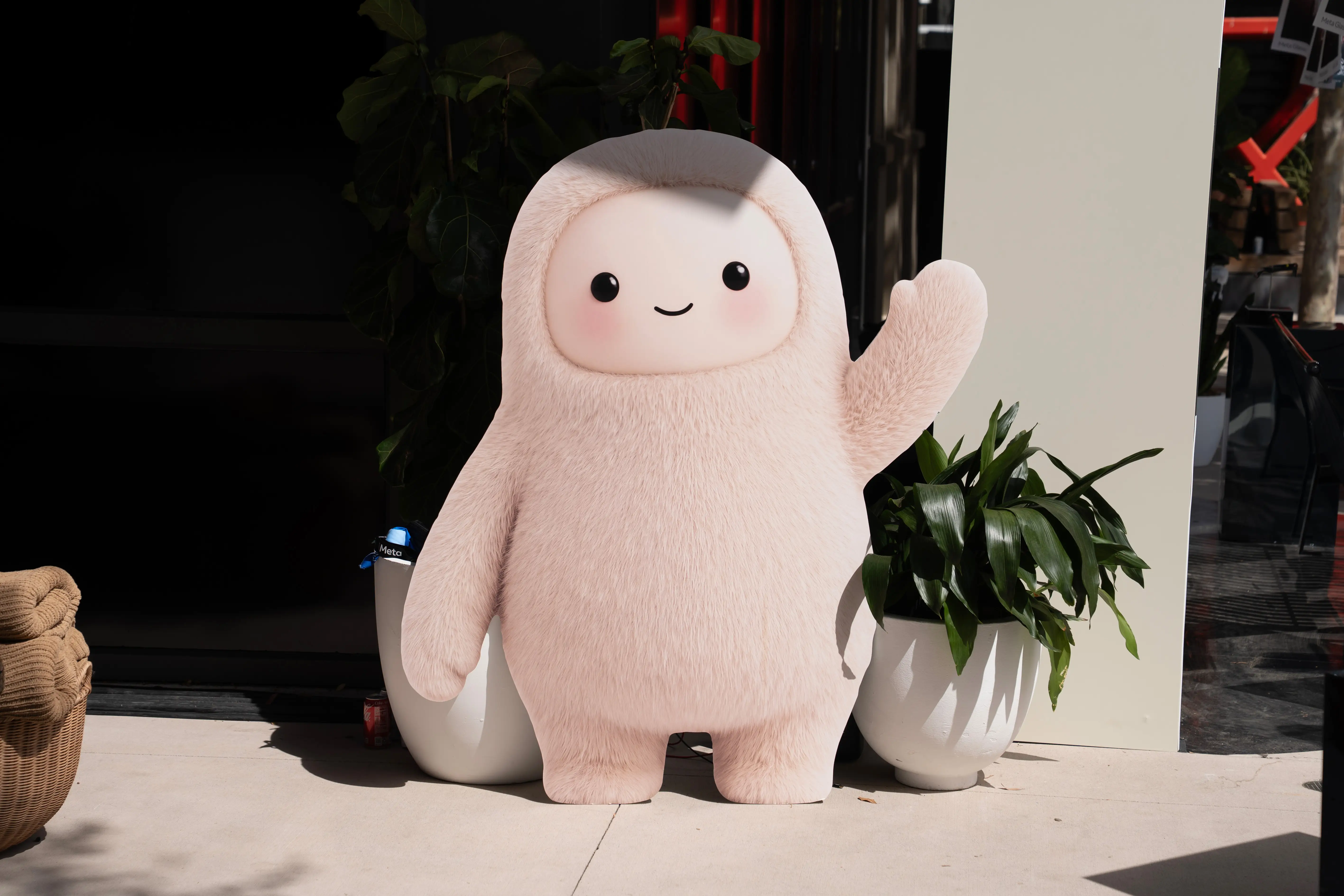 Jolly, Meta's mascot for its Muse agent, waves.