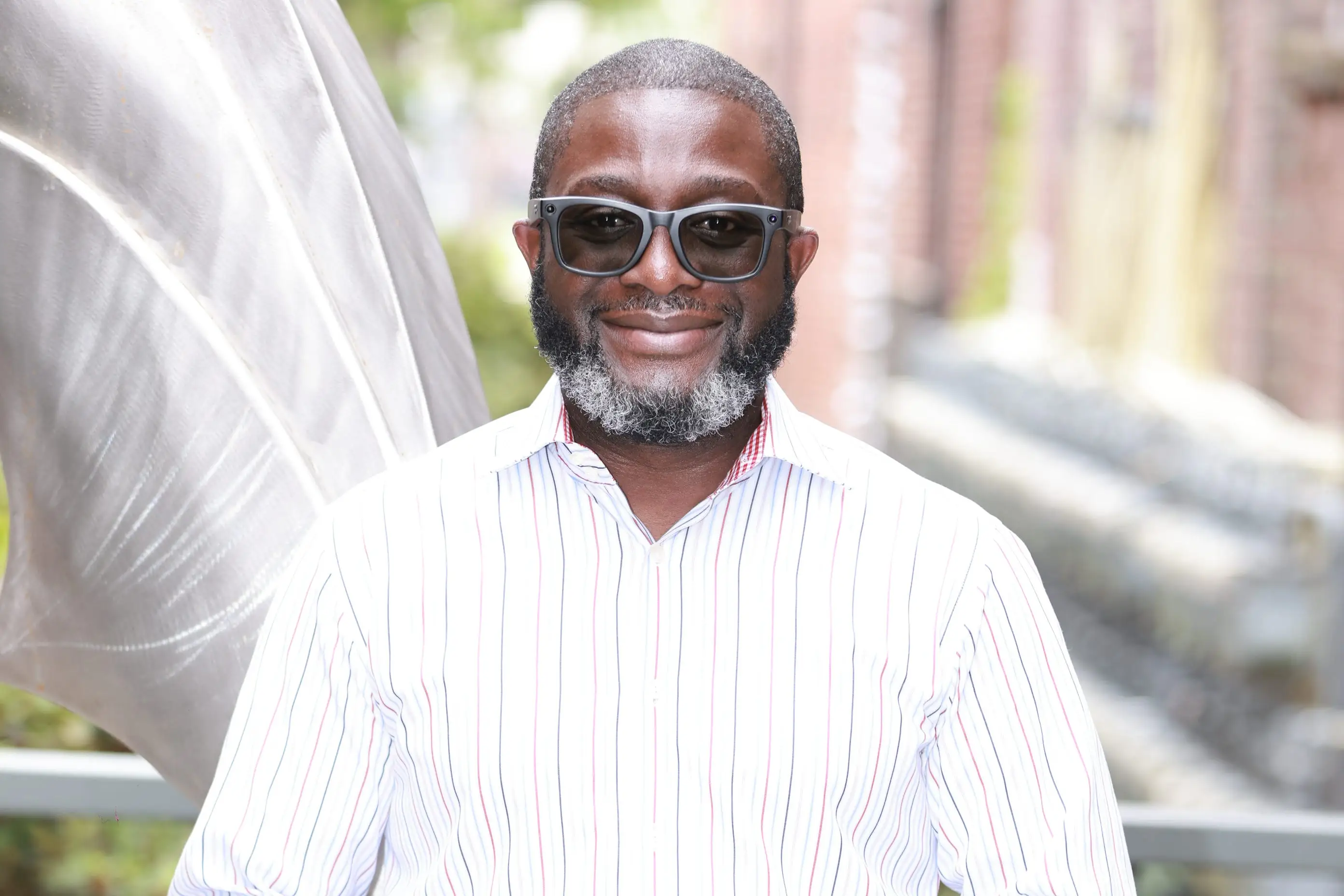 Adekunle Ayodele wearing a white shirt