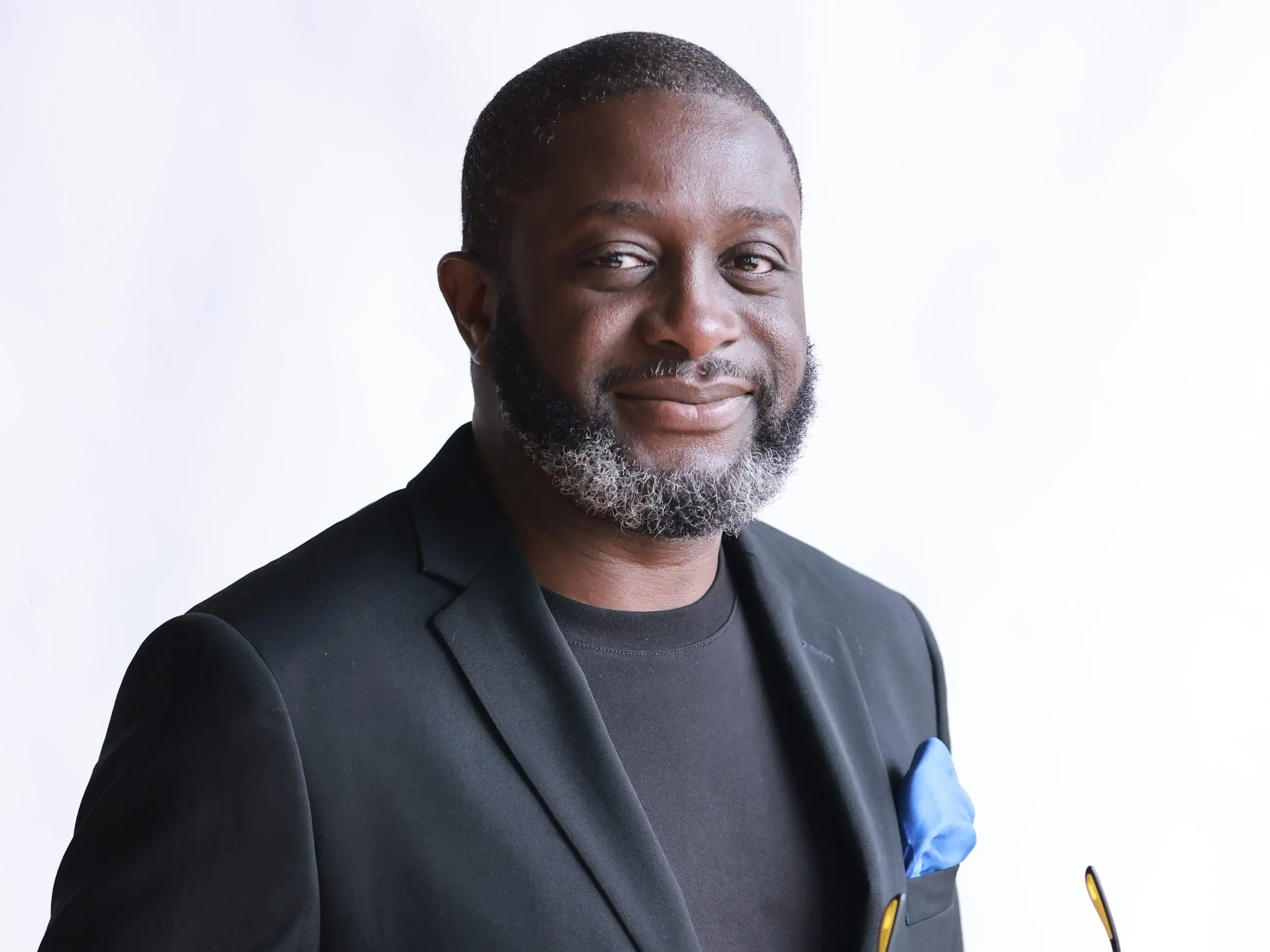 Adekunle Ayodele is wearing a black blazer.