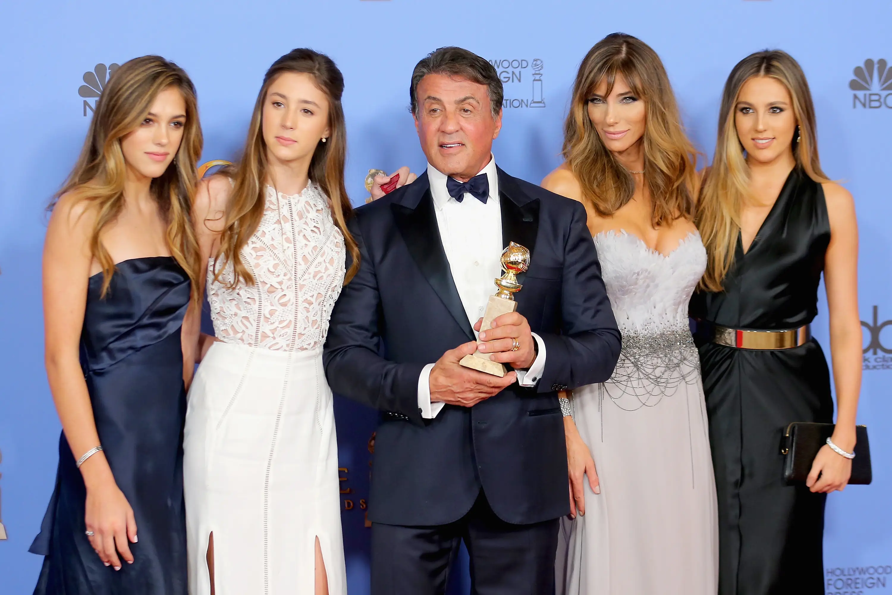 Actor Sylvester Stallone (C), winner of Best Supporting Performance in a Motion Picture for 'Creed,' poses in the press room with wife Jennifer Flavin (2nd R) and daughters Sistine, Sophia and Scarlet during the 73rd Annual Golden Globe Awards held at the Beverly Hilton Hotel on January 10, 2016
