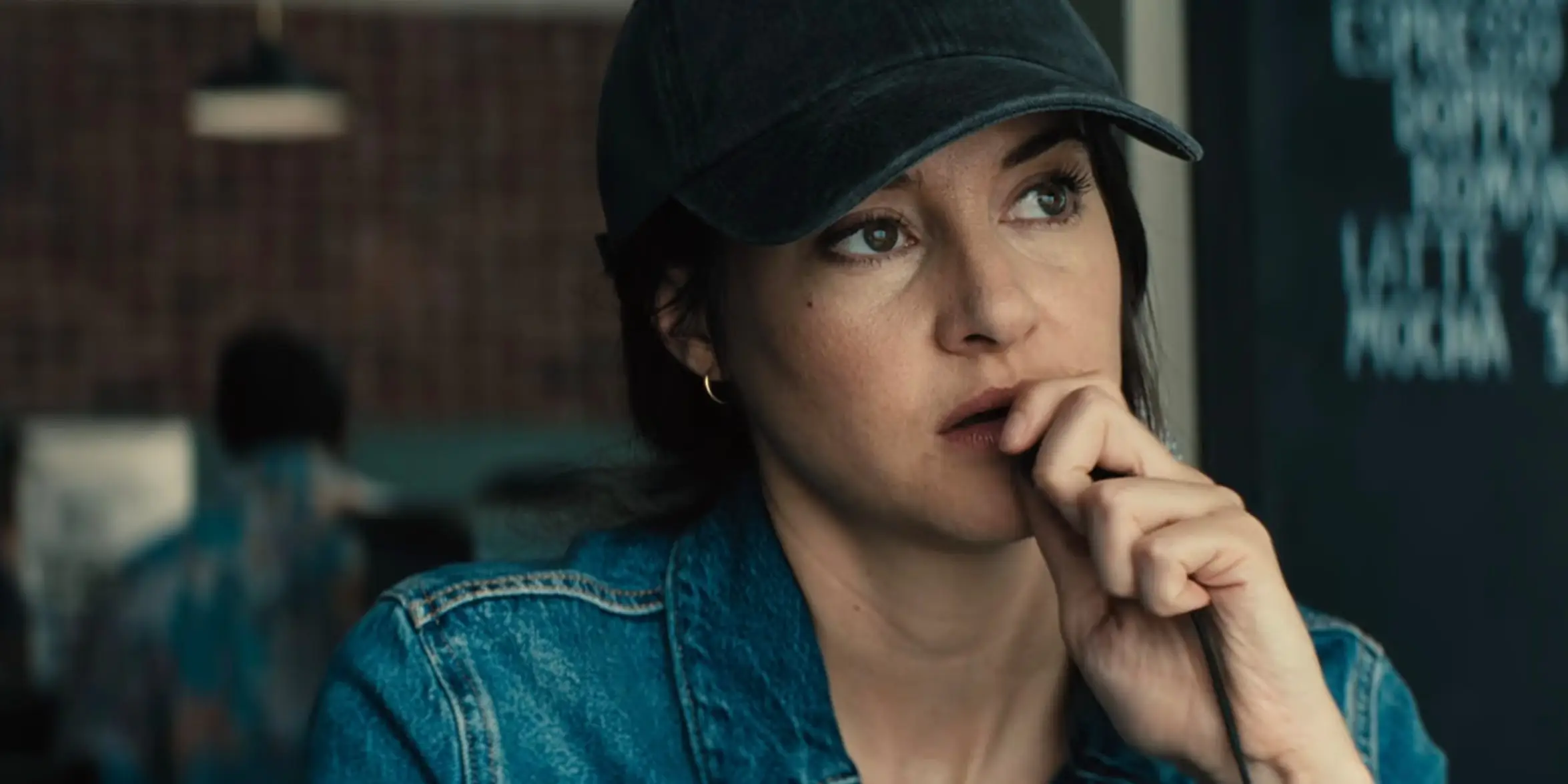 Shailene Woodley walking into a microphone in Unabomber movie