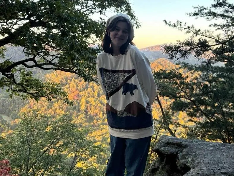 Berea College student Grace Mullins in the Appalachian mountains surrounding the school's campus.