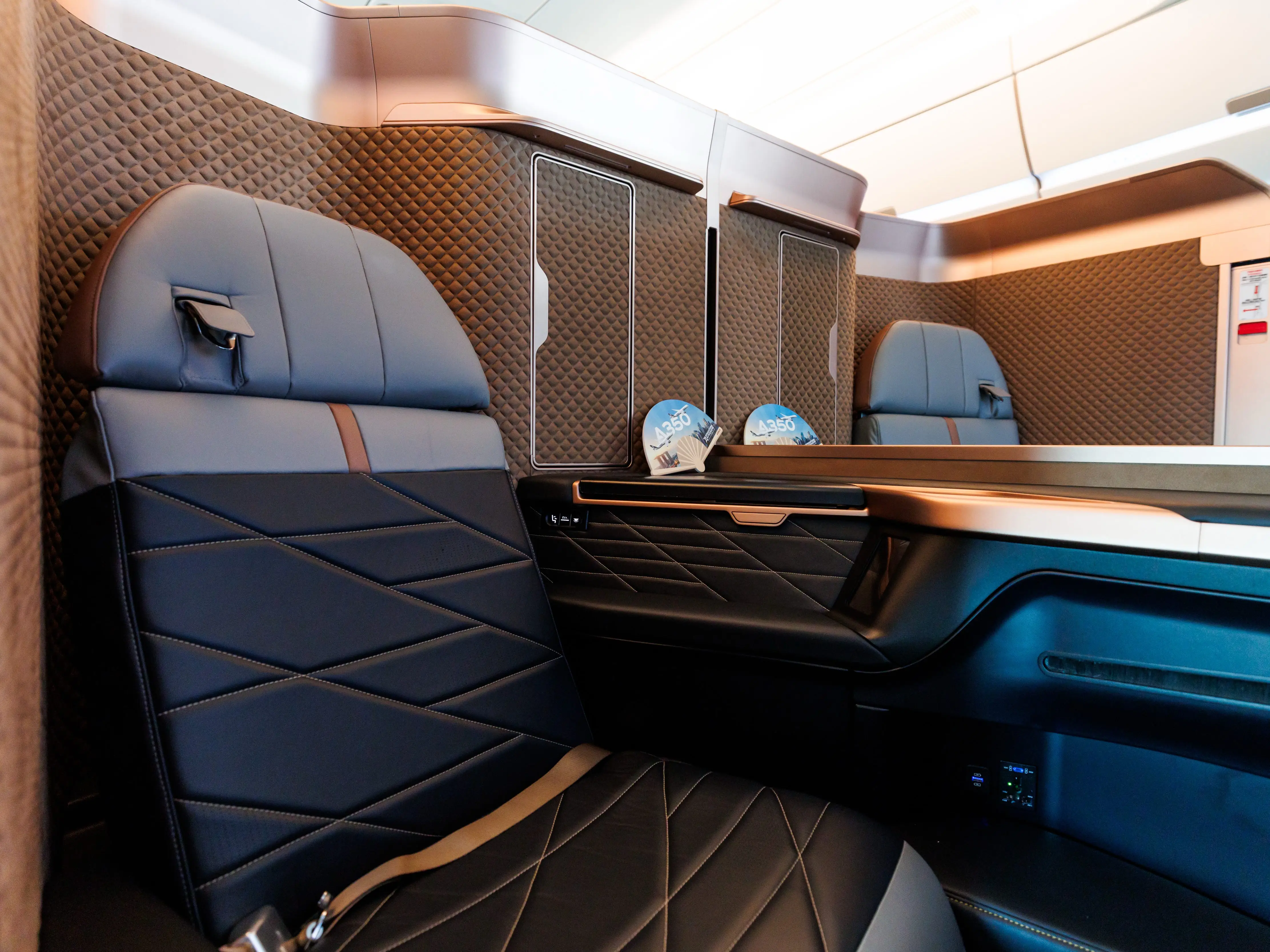 Business-class seats onboard an Airbus SE A350-1000 aircraft operated by Starlux Airlines.