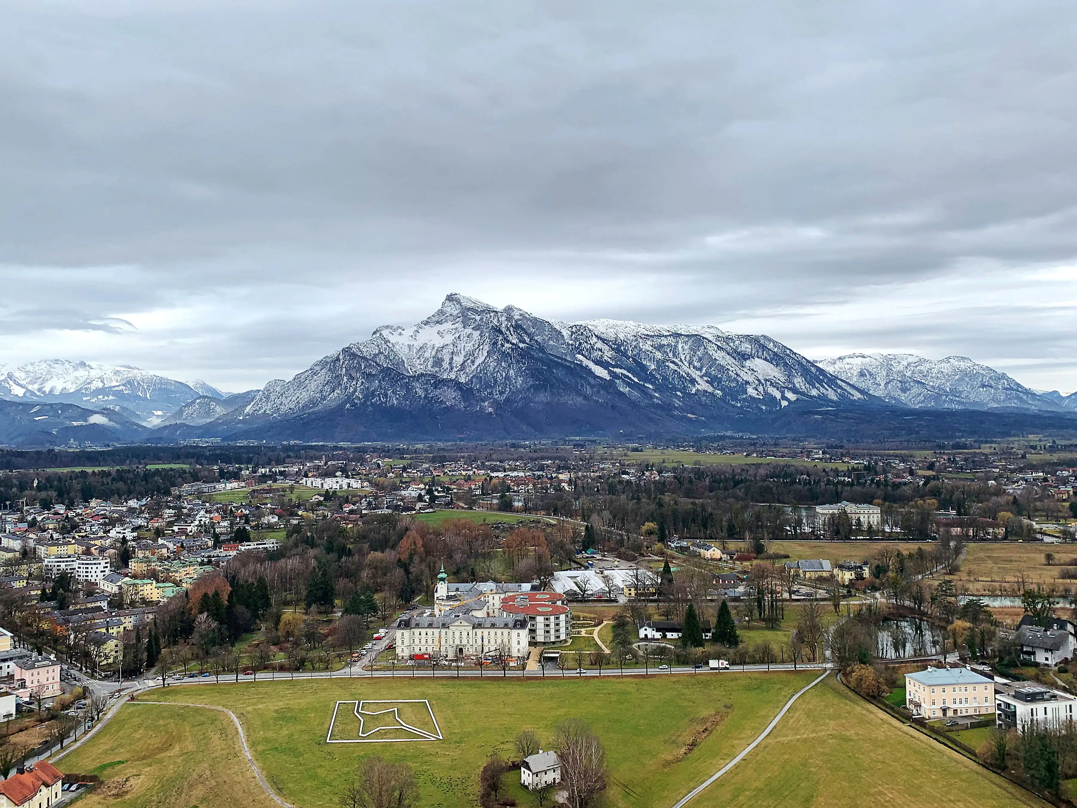 The view of mountains and buildings from Fortress Hohensalzburg in Salzburg, Austria.