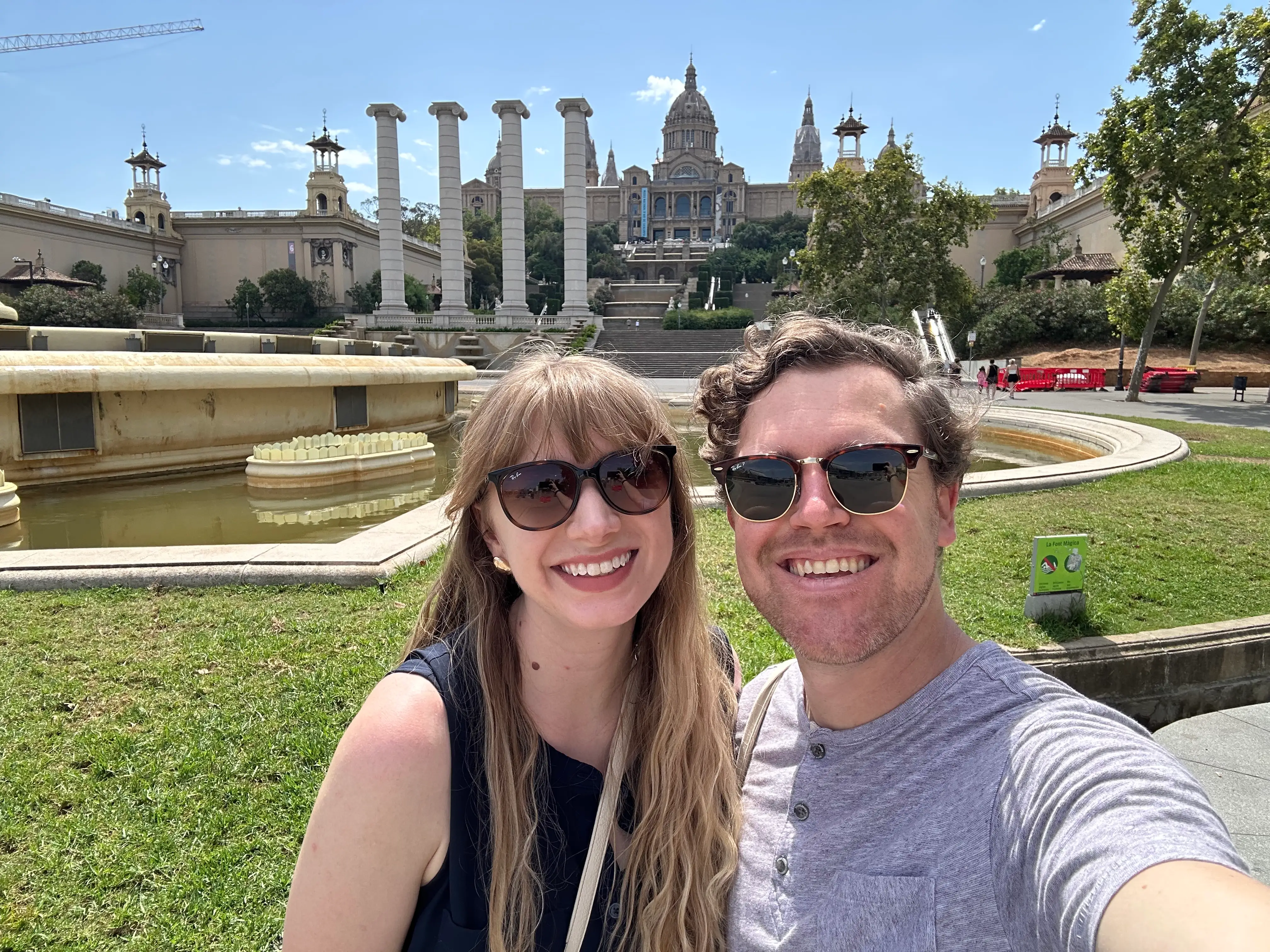 Emily and her husband pose for a photo in Barcelona.