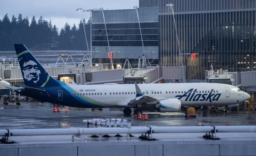 An Alaska Airlines Boeing 737 MAX 9 plane sits at a gate at Seattle-Tacoma International Airport.