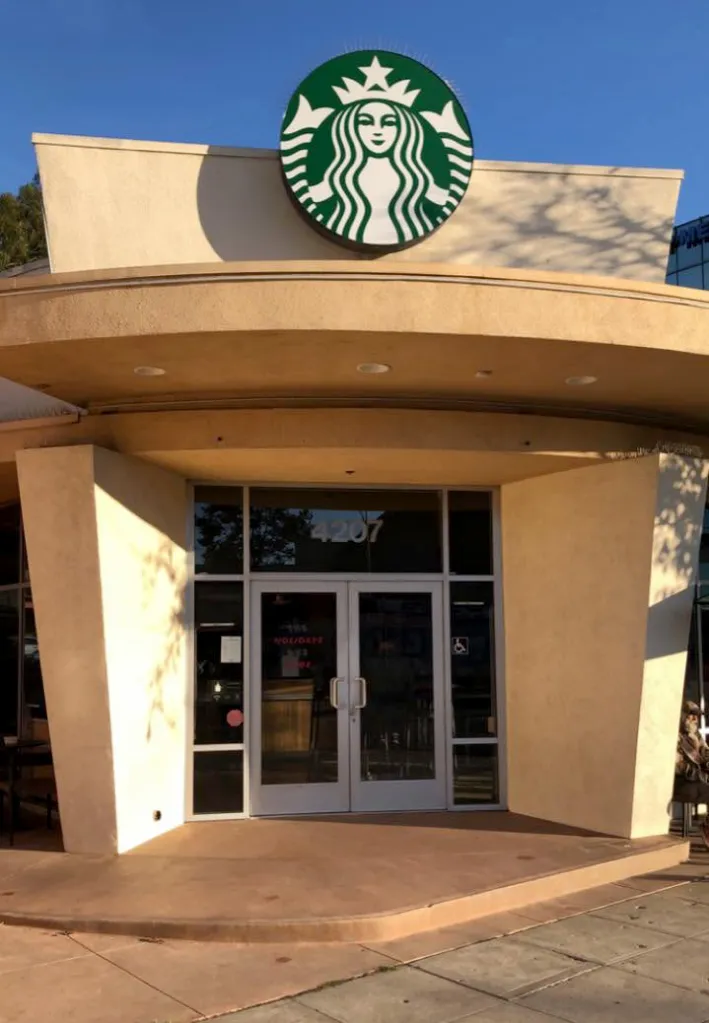 Exterior of the Los Angeles Starbucks, showing the main entrance and the Starbucks logo.