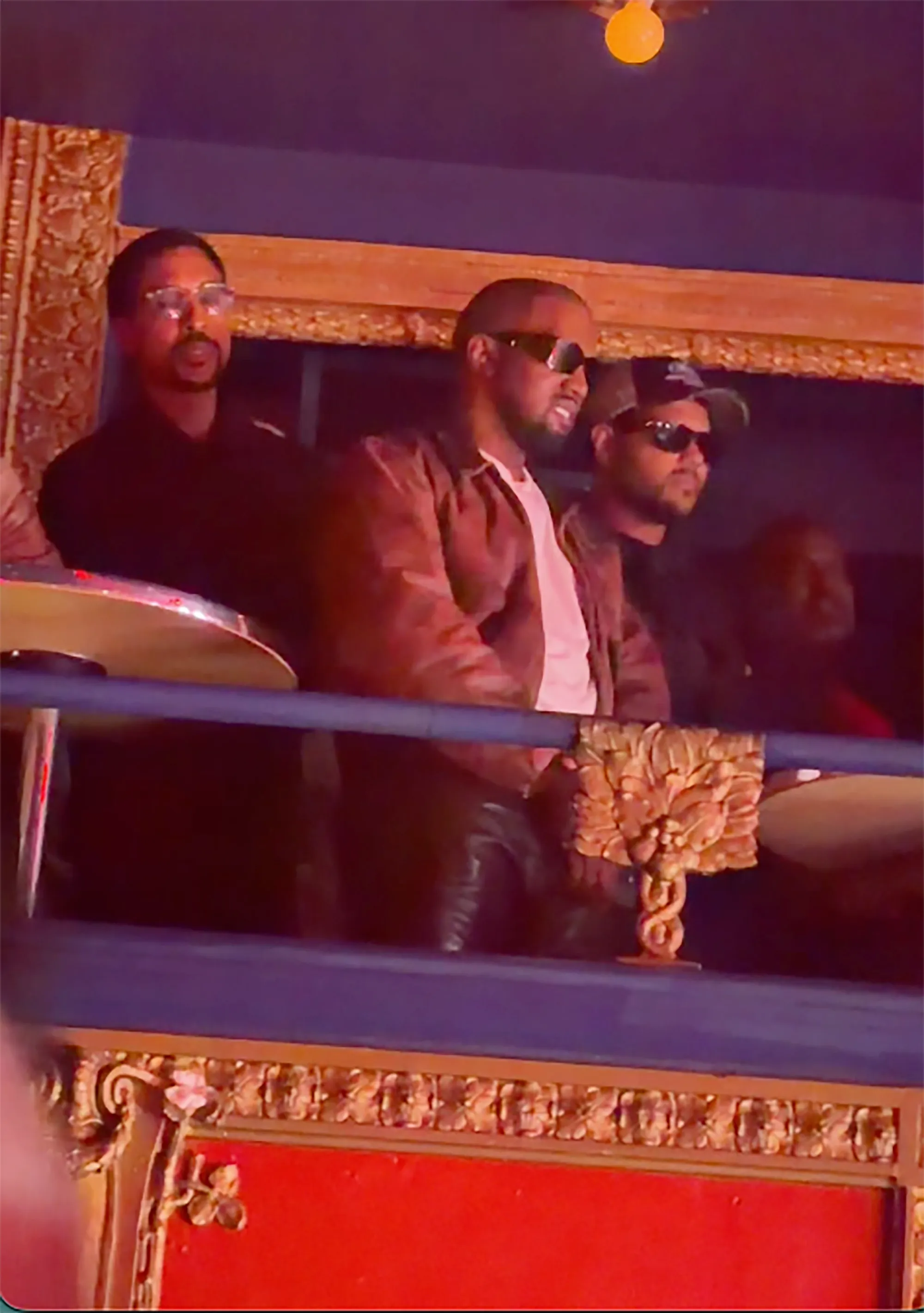 Kanye West and companions at North West's first solo concert.