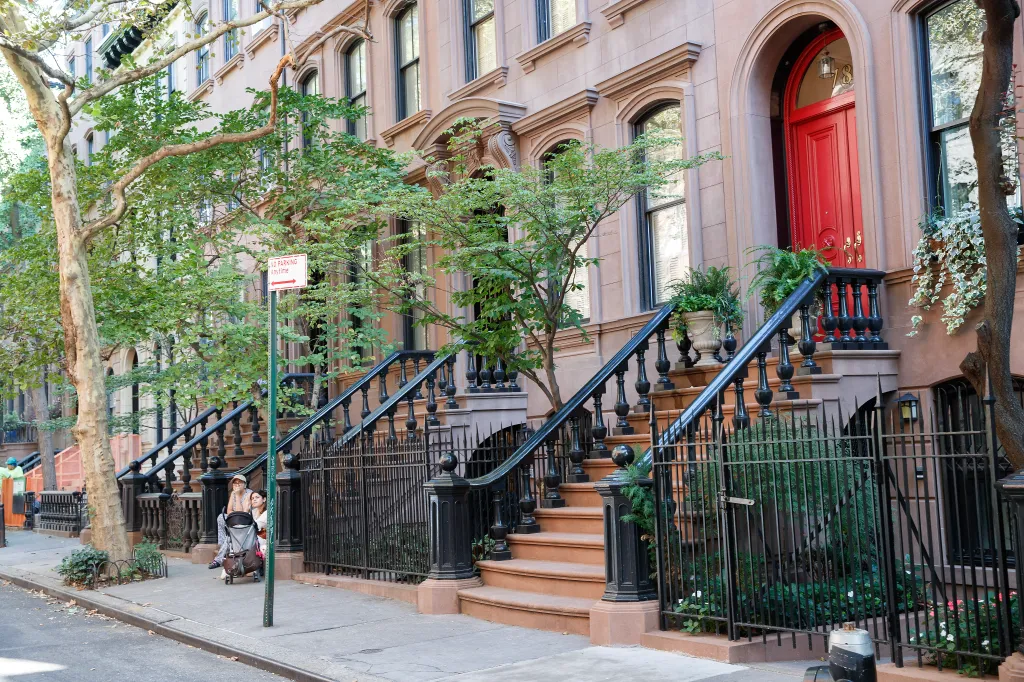 Elevated stoops line Perry Street in New York City.