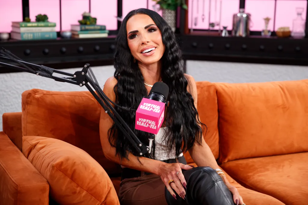 Carmella Garcia on a podcast with a microphone labeled 