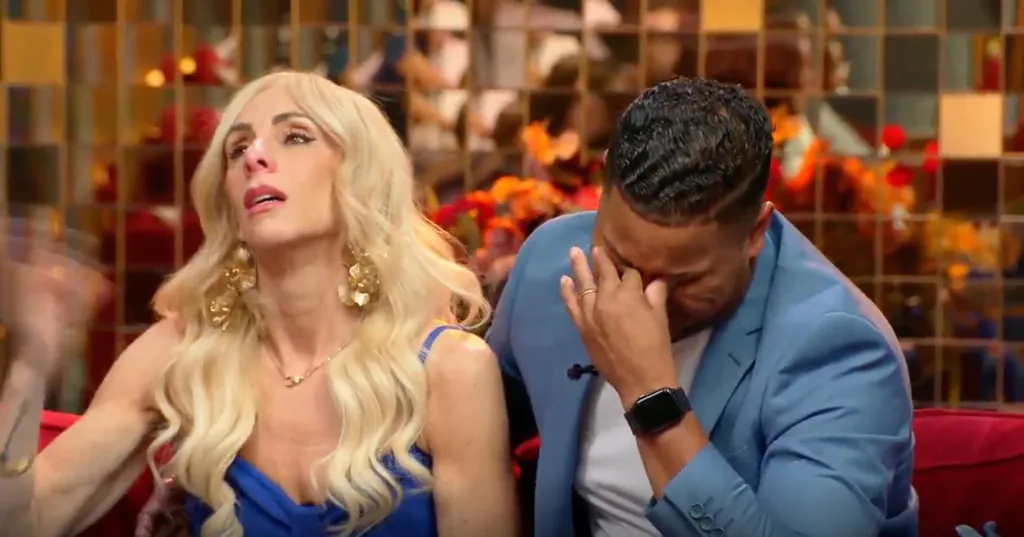 Two people, a blonde woman and a dark-haired man, crying at the 90-Day Fiance tell-all.