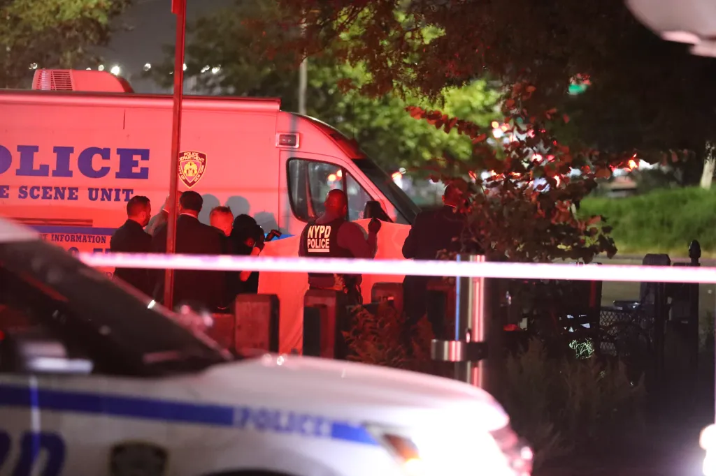 Police investigate the scene where an unidentified female was found dead in Sheepshead Bay, Brooklyn.