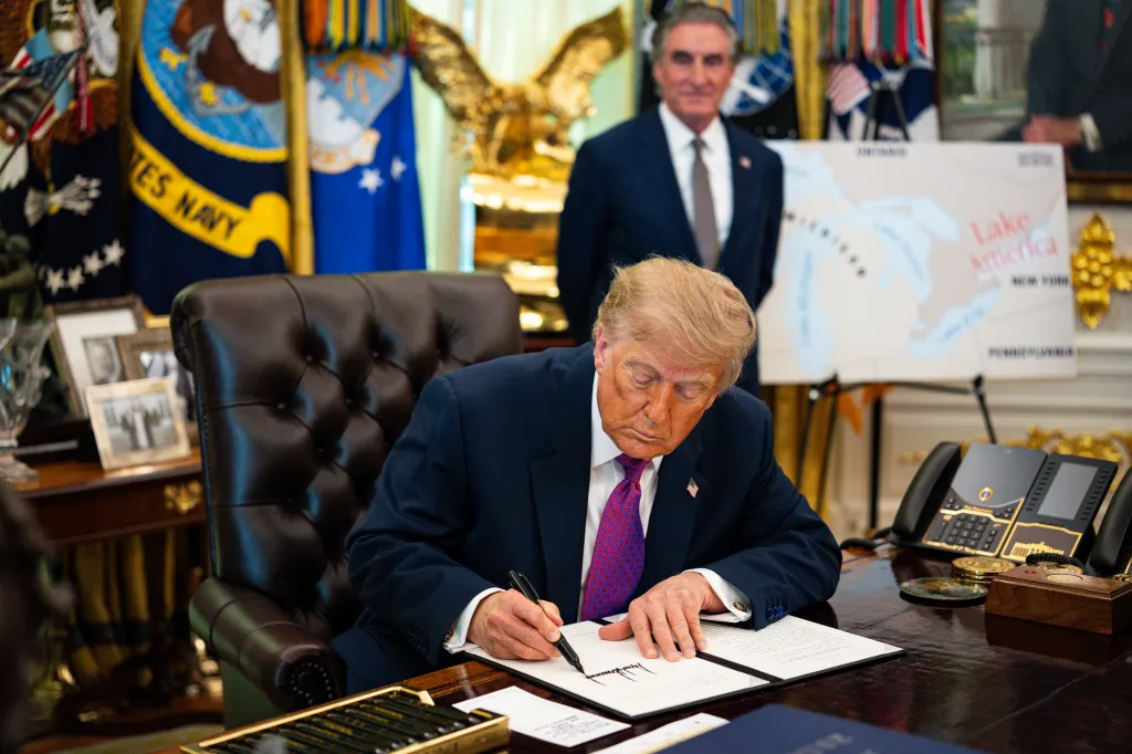 Donald Trump signing an executive order to rename Lake Ontario to Lake America.