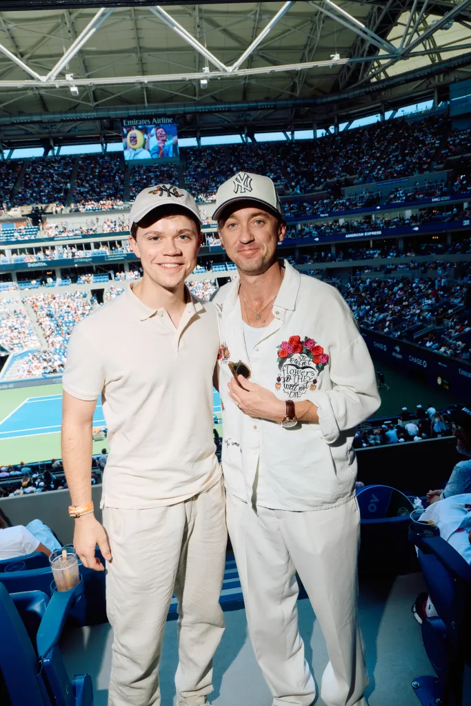 Tom Felton and a guest at the US Open.