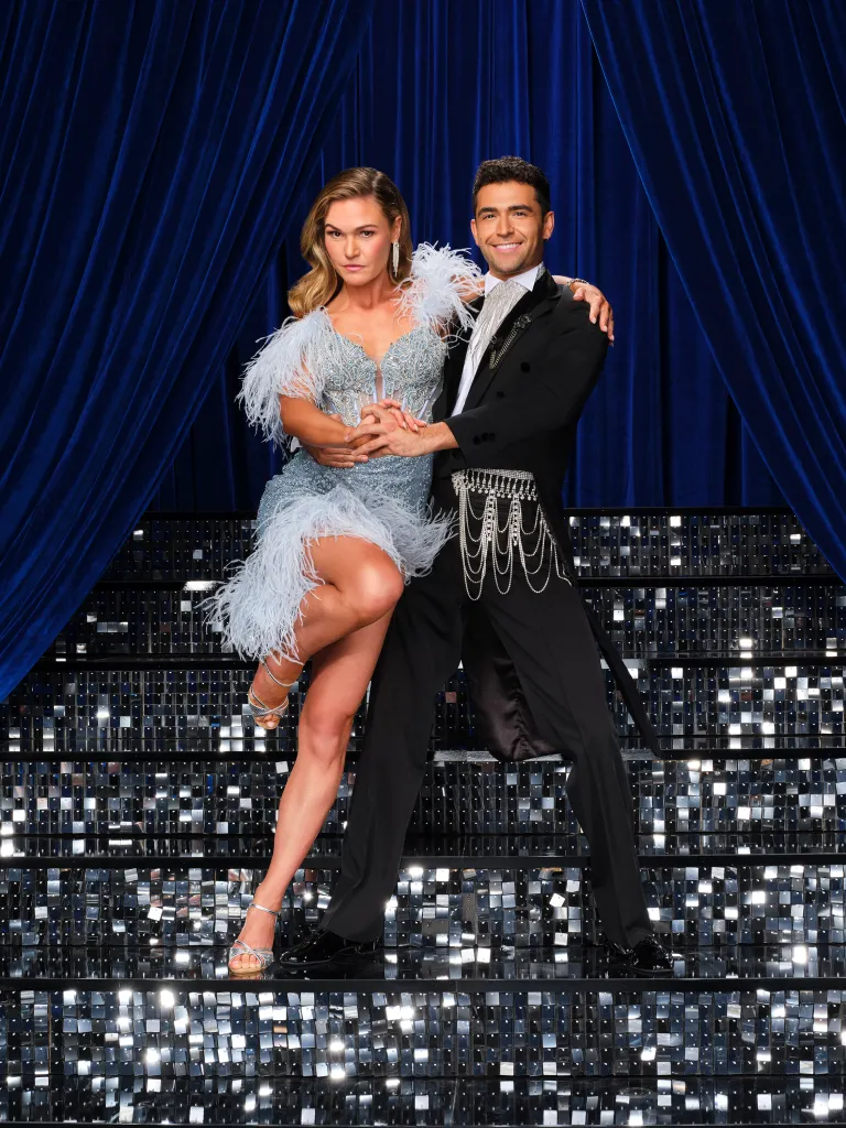 Julia Stiles and Ezra Sosa pose in dancing costumes.