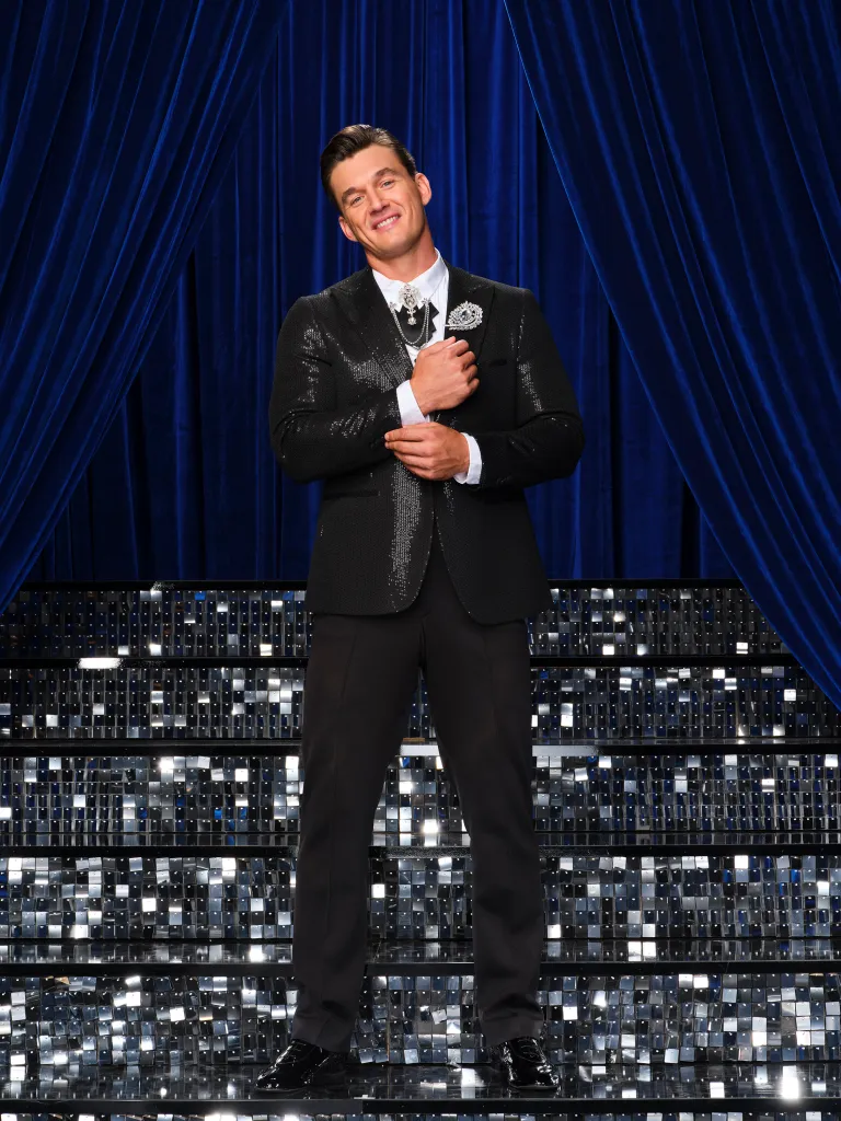 Tyler Cameron in a sequined suit on 