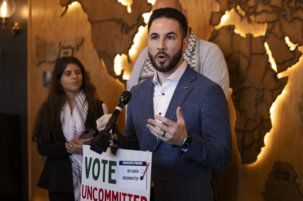 Dearborn Mayor Abdullah Hammoud speaking at a press conference, with a 