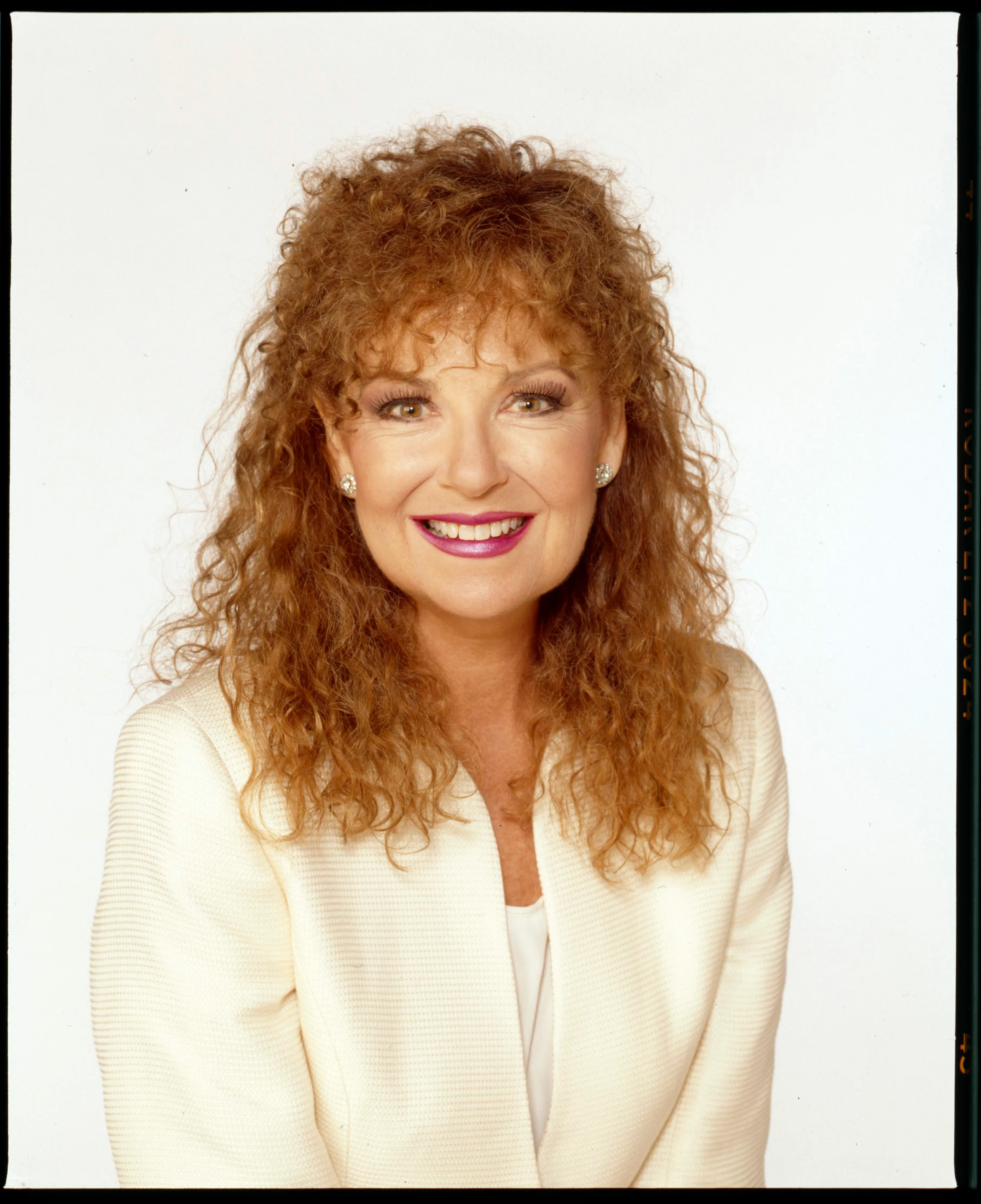 Actress Shelley Fabares in a headshot with a white background, wearing a white jacket.