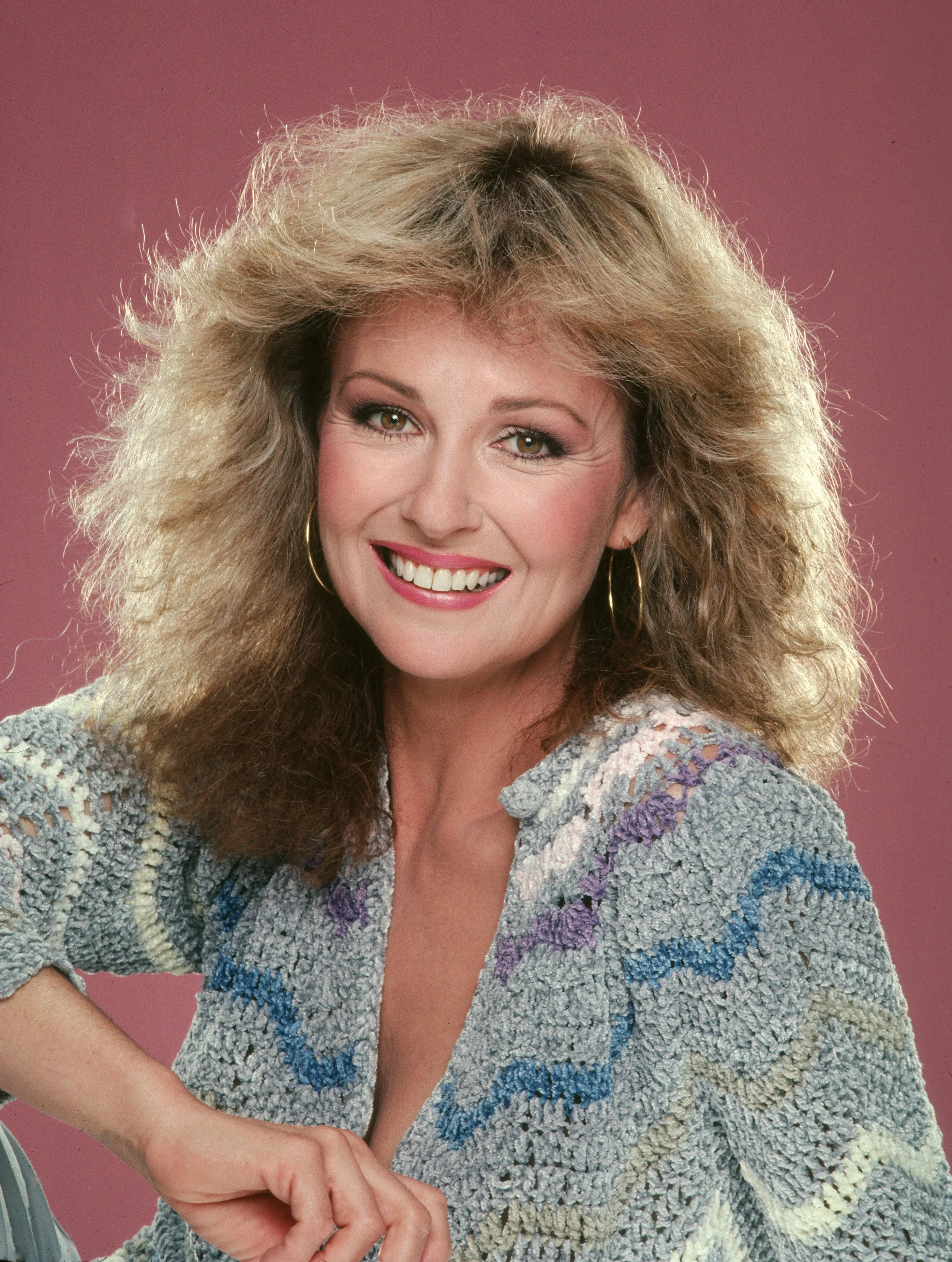 Actress Shelley Fabares smiling and wearing a crocheted sweater.