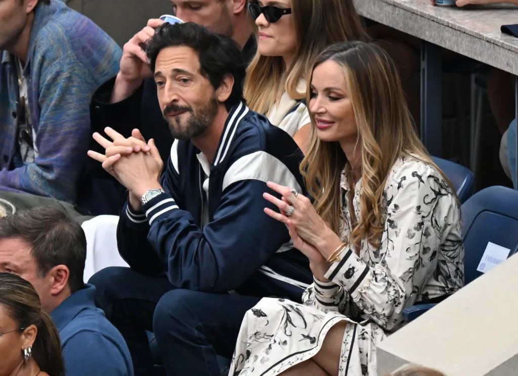 Adrien Brody and Georgina Chapman watching the Men's Finals at the US Open.