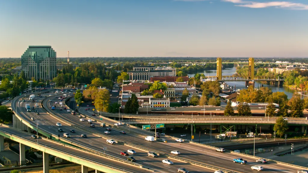 Aerial view of Interstate 5 passing through downtown Sacramento, California at sunrise.