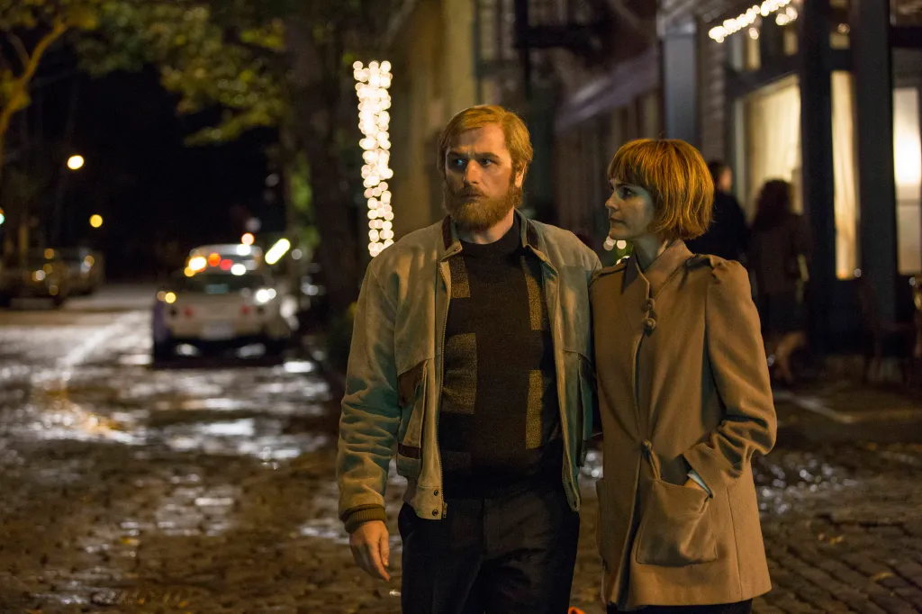 Keri Russell, in a cropped wig and brown coat, and Matthew Rhys, in a blonde wig and beard in a khaki jacket and black sweater, on 'The Americans'.