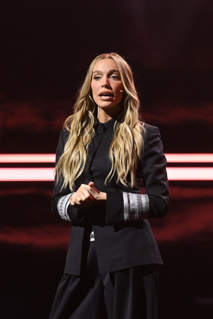 Alex Cooper speaks onstage at the YouTube Brandcast event.