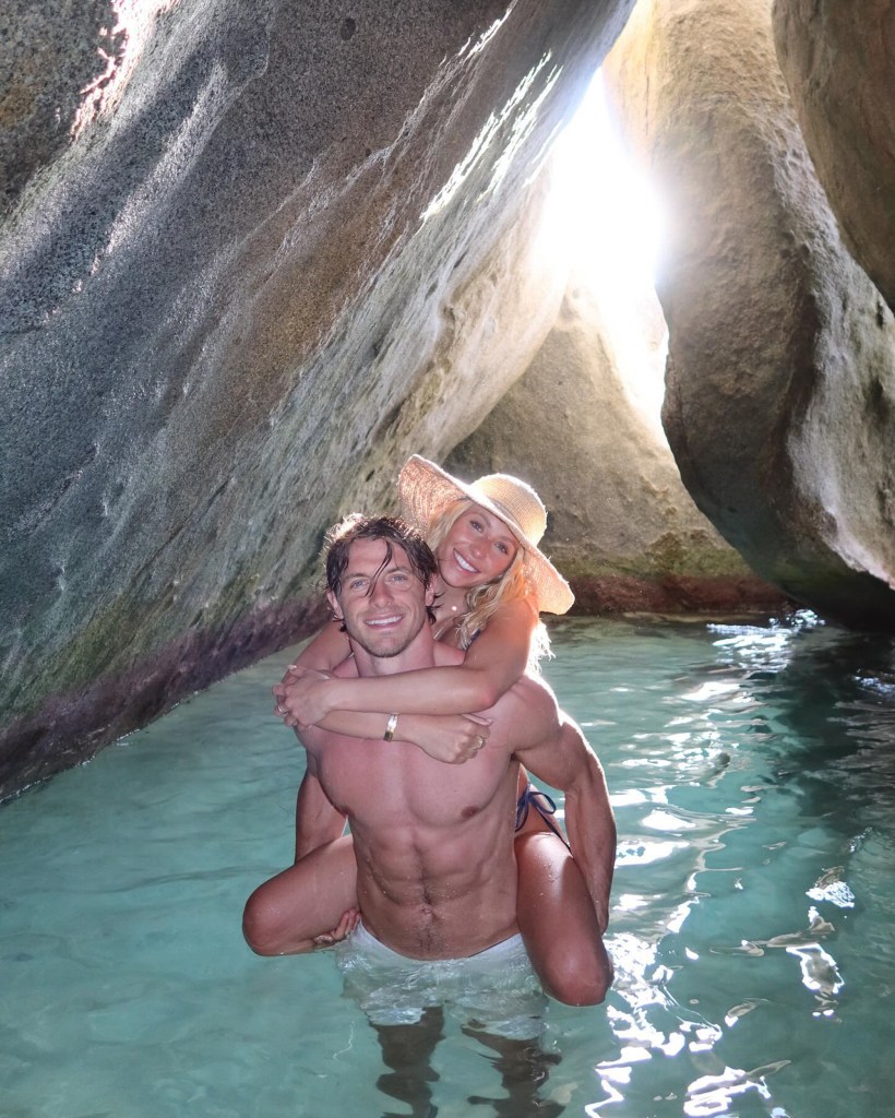 Alix Earle piggybacking Braxton Berrios in a natural pool.