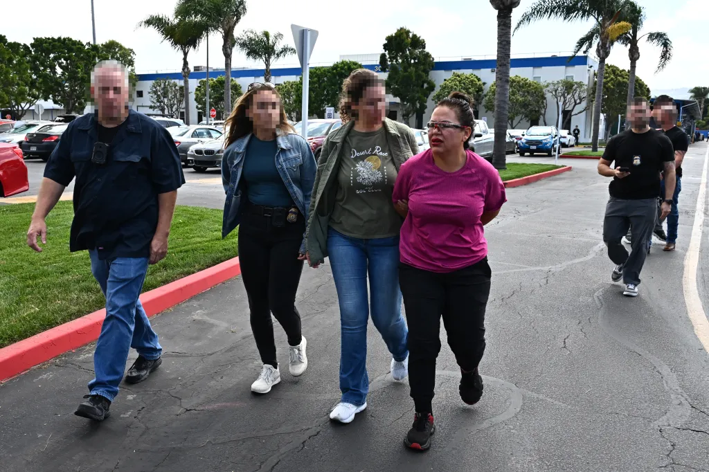Alma Patricia Contreras Villafana (right) is arrested by agents from U.S. Homeland Security.