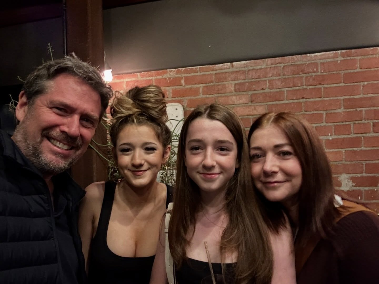 Alyson Hannigan with her husband and two daughters.