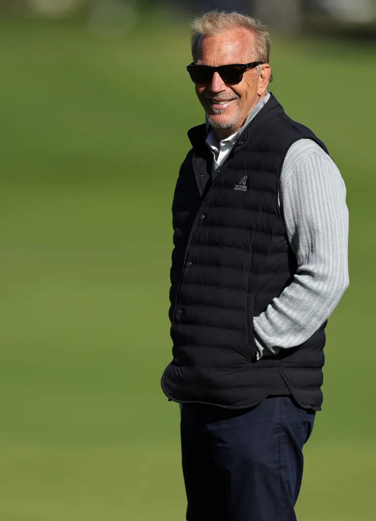 Kevin Costner smiles while walking on the 2nd green at The Genesis Invitational 2026.