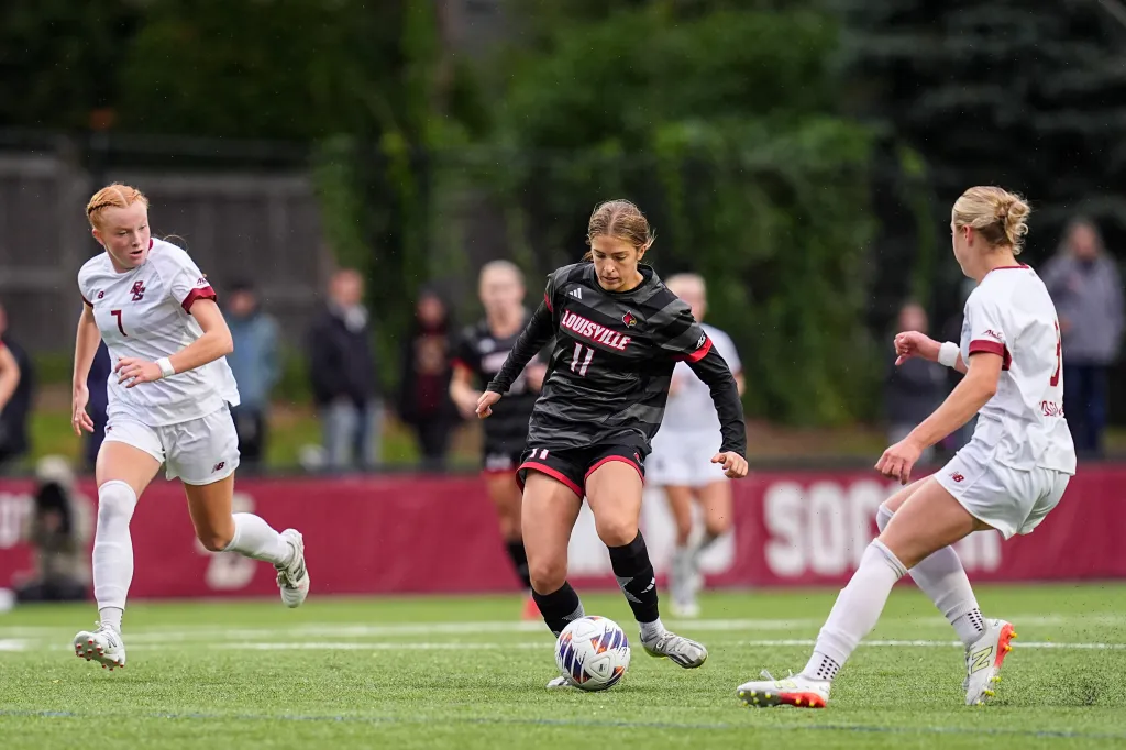 Amelia Swinarski (11) from the University of Louisville passes the ball during a game against Boston College.