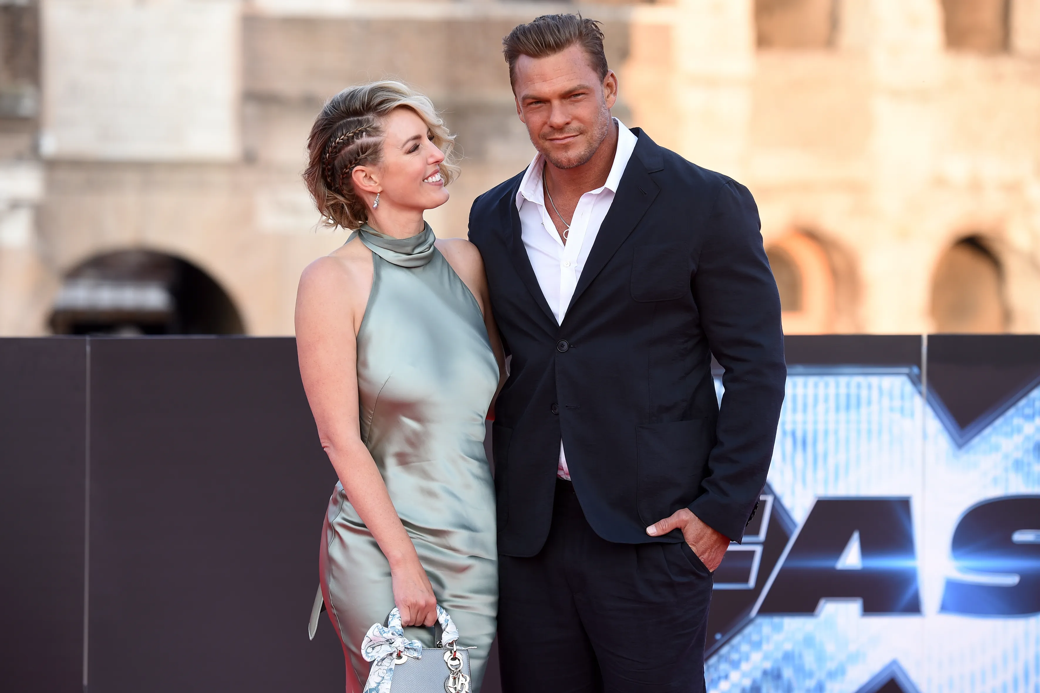 Alan Ritchson and Catherine Ritchson on the red carpet.