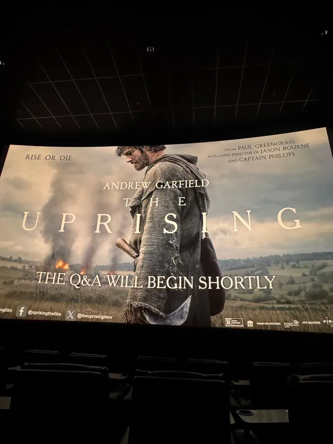Movie screen displaying a poster for 