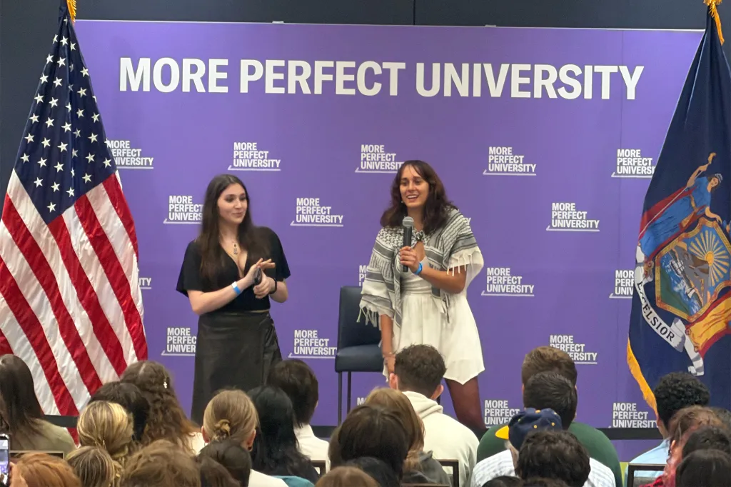 Two women speaking at a 