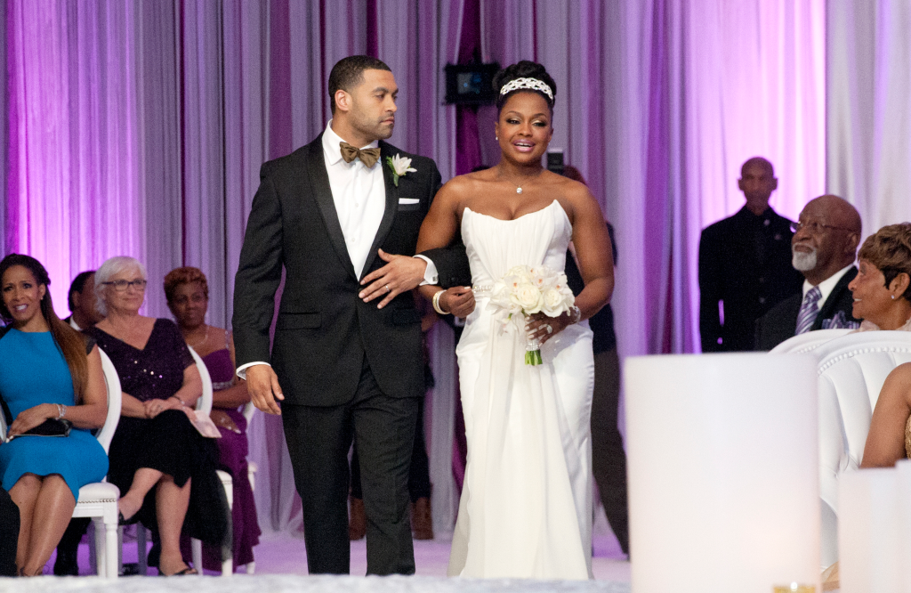 Apollo Nida and Phaedra Parks walk down the aisle.