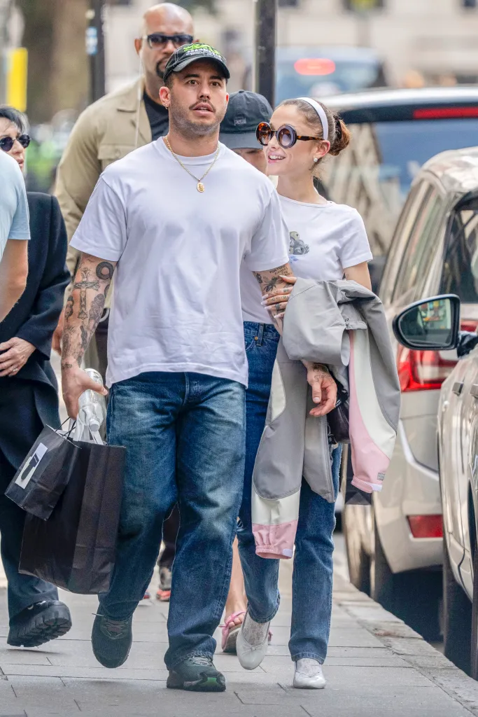 Ariana Grande and Ricky Alvarez walking together with Joan Grande during an outing in London.