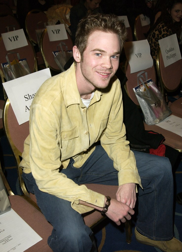 Shawn Ashmore smiling while seated in the front row.