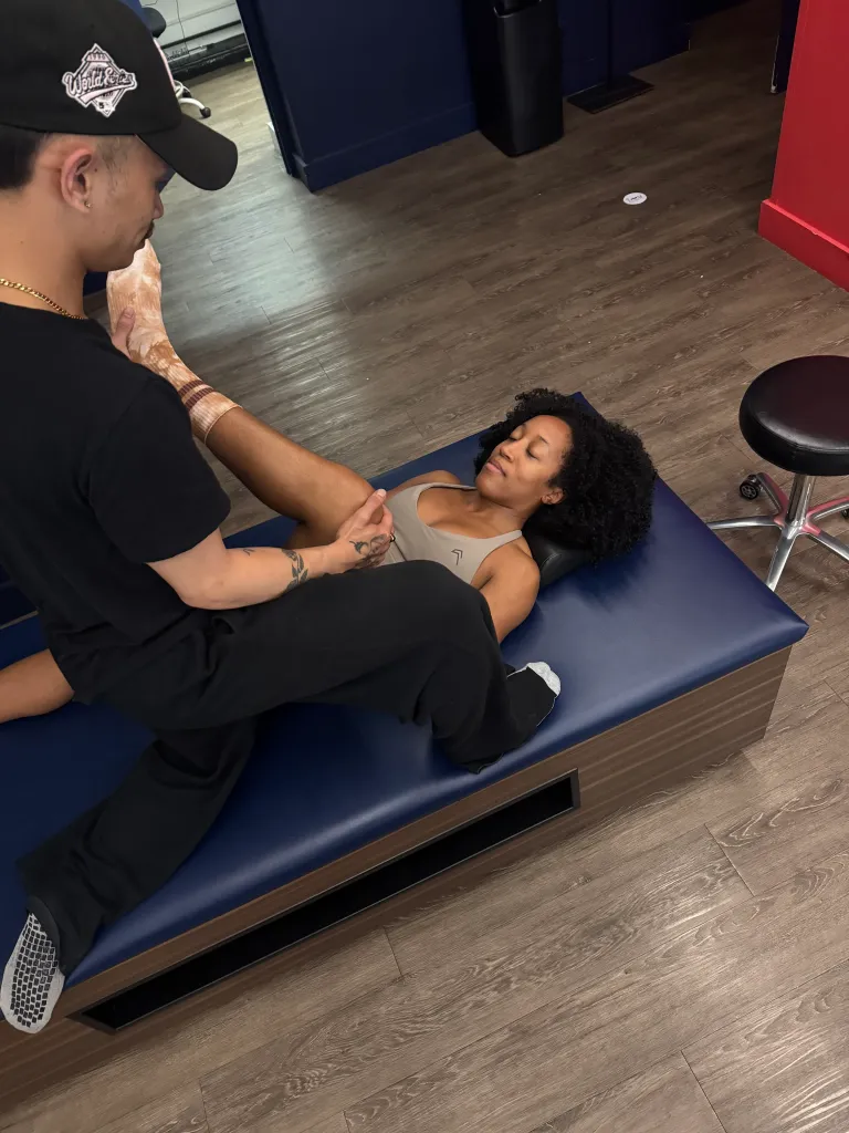 Patrice receiving assisted stretching.