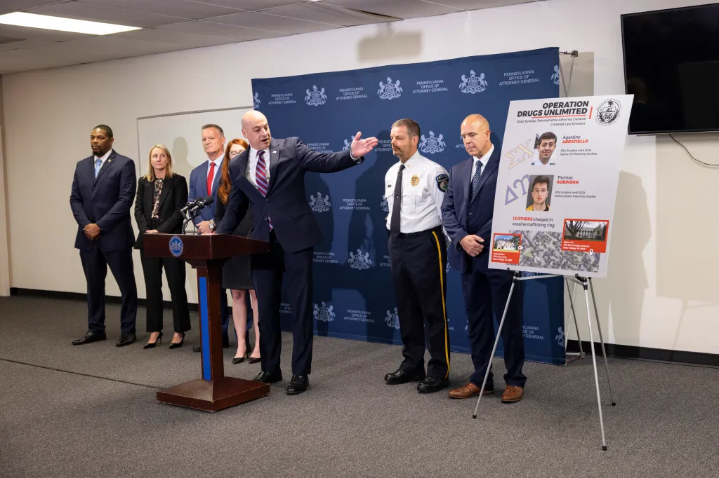 Attorney General Dave Sunday announces charges against 14 students involved in a campus drug ring.
