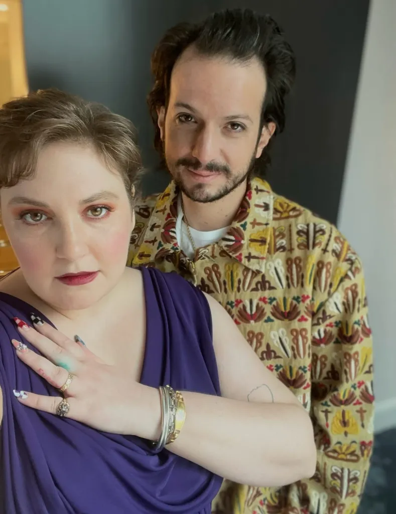 Lena Dunham and her husband, Luis Felber, posing for a photo.