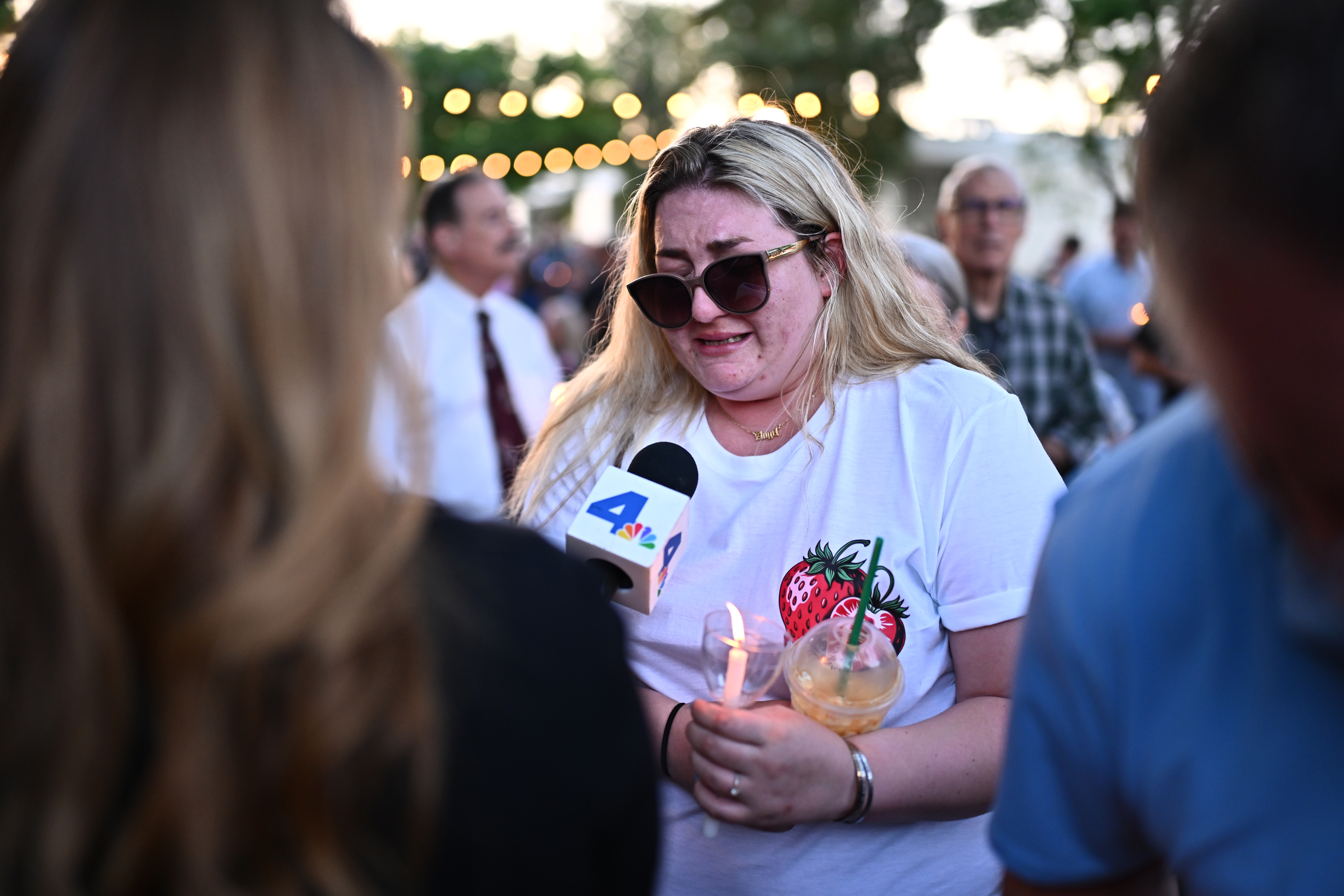 Autumn Reiff, girlfriend of Gage Weida, speaks to a reporter during a vigil.