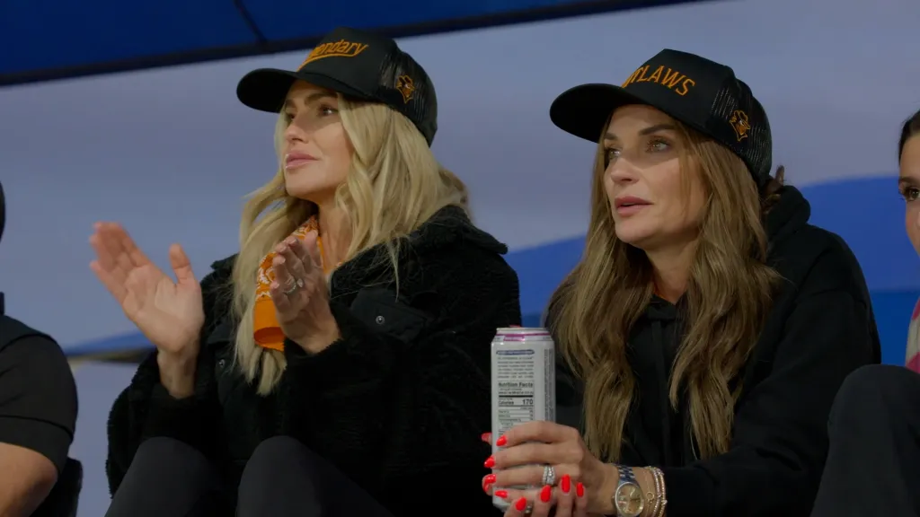 Trish Mears and Trina Taylor watching a game.
