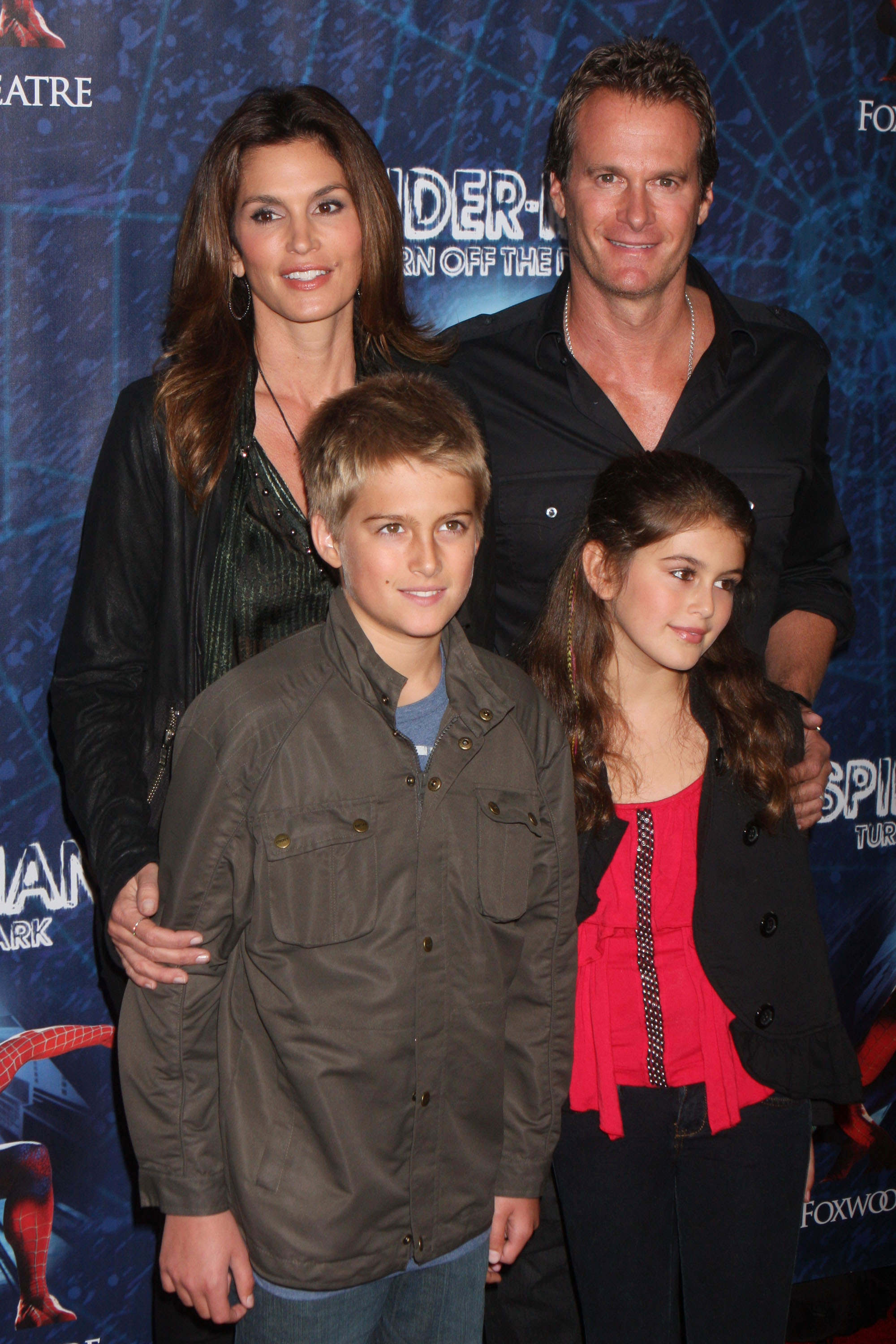 Cindy Crawford, Rande Gerber, and their children, Presley and Kaia Gerber, smiling for a family portrait.