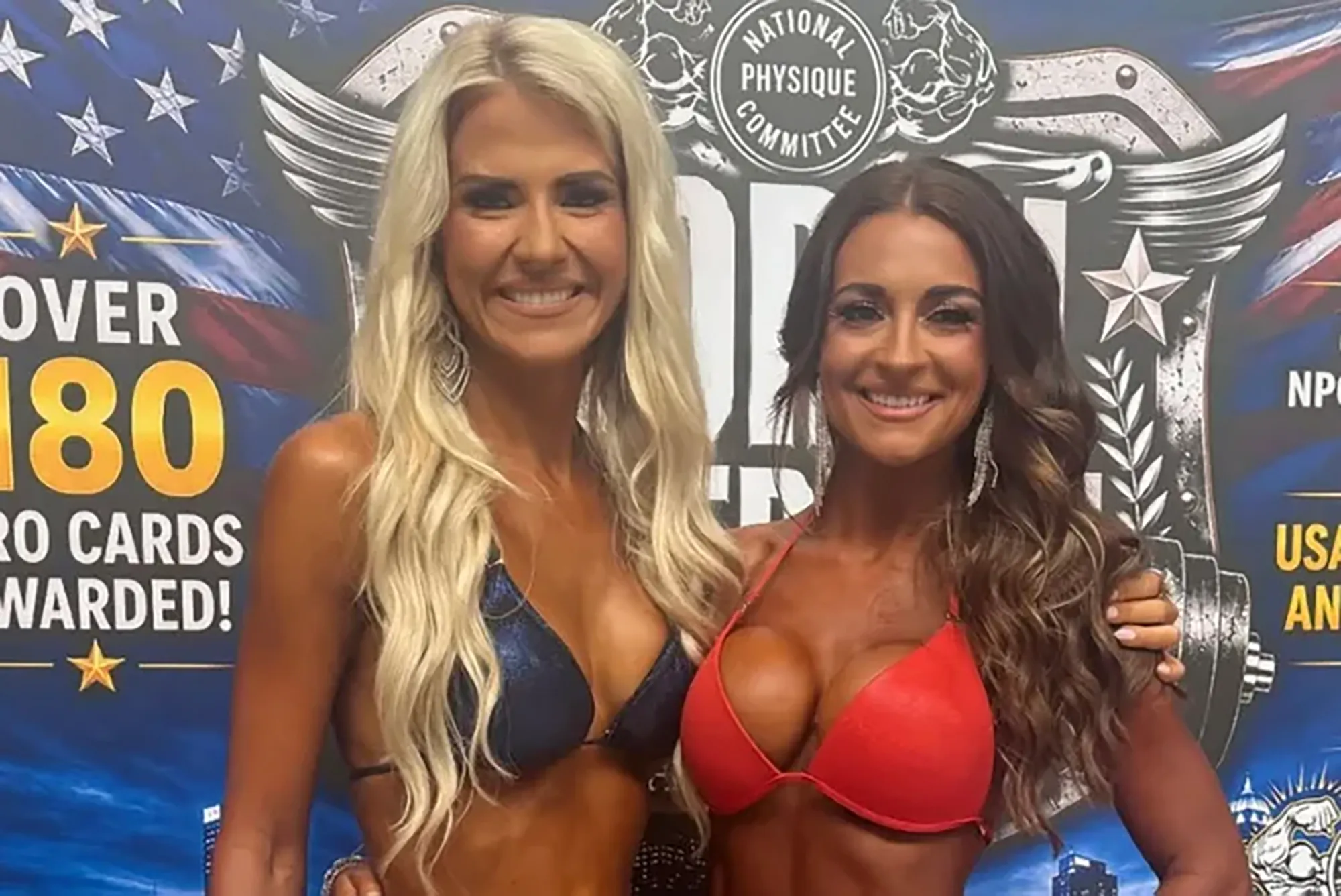 Elizabeth Smart posing with a fellow competitor at a bodybuilding competition.