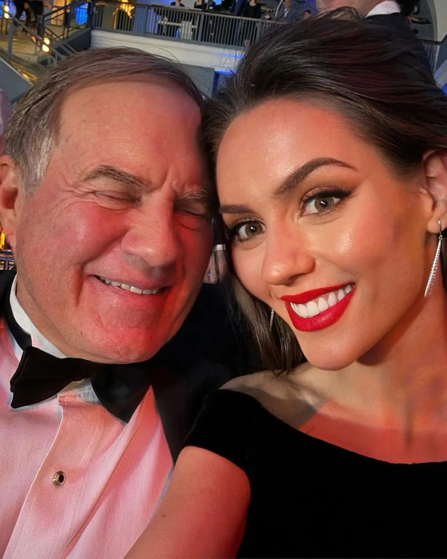 Bill Belichick and Jordon Hudson smile for a selfie.