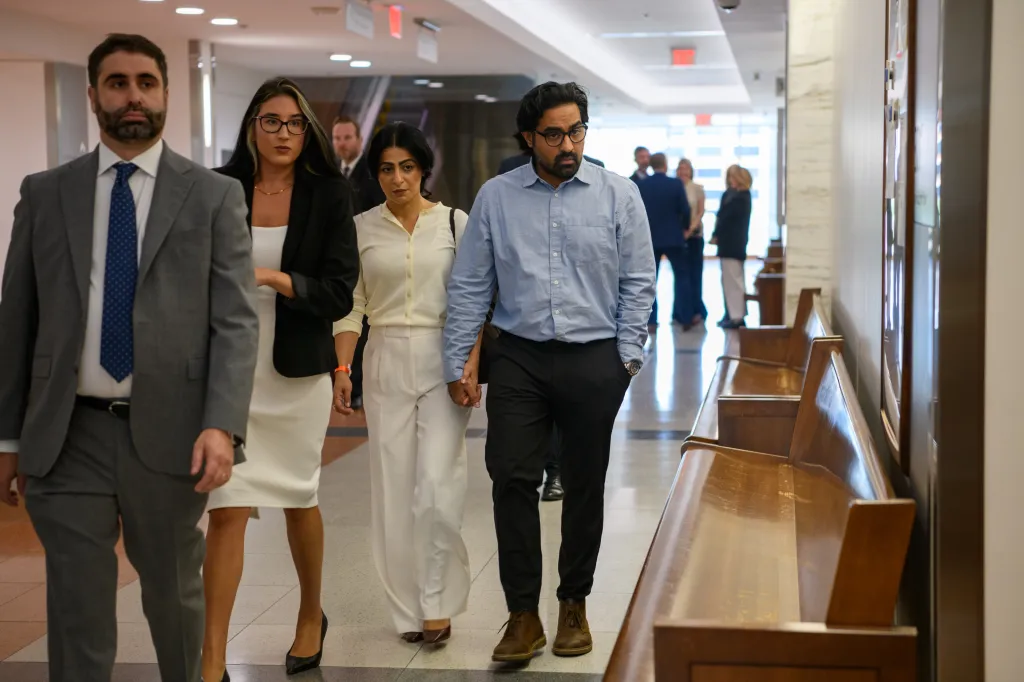 Biological parents Nasheen Gilkar and Omar Ahmed with their attorneys at the Dallas County Courthouse.
